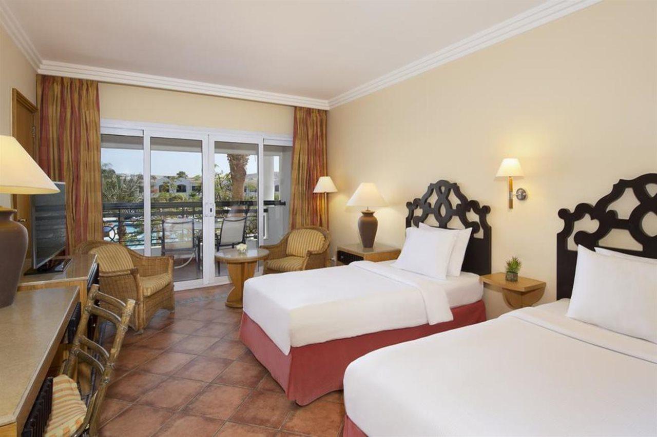 Отель Sharm Dreams Vacation Club - Aqua Park Экстерьер фото A room at the Hilton Luxor