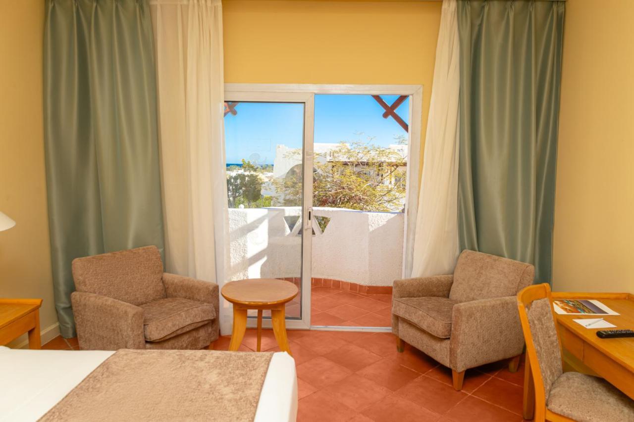 Отель Sharm Dreams Vacation Club - Aqua Park Экстерьер фото A room at the hotel